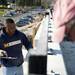 Iron worker Kelly Thomas installs a handrail on the east Stadium bridge on Sunday. Daniel Brenner I AnnArbor.com